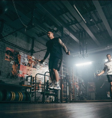 Athletes skipping in an industrial gym